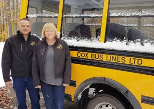 Mitch & Jen Cox will fire up their snowmobiles next winter, rather than clear snow off their buses each morning.